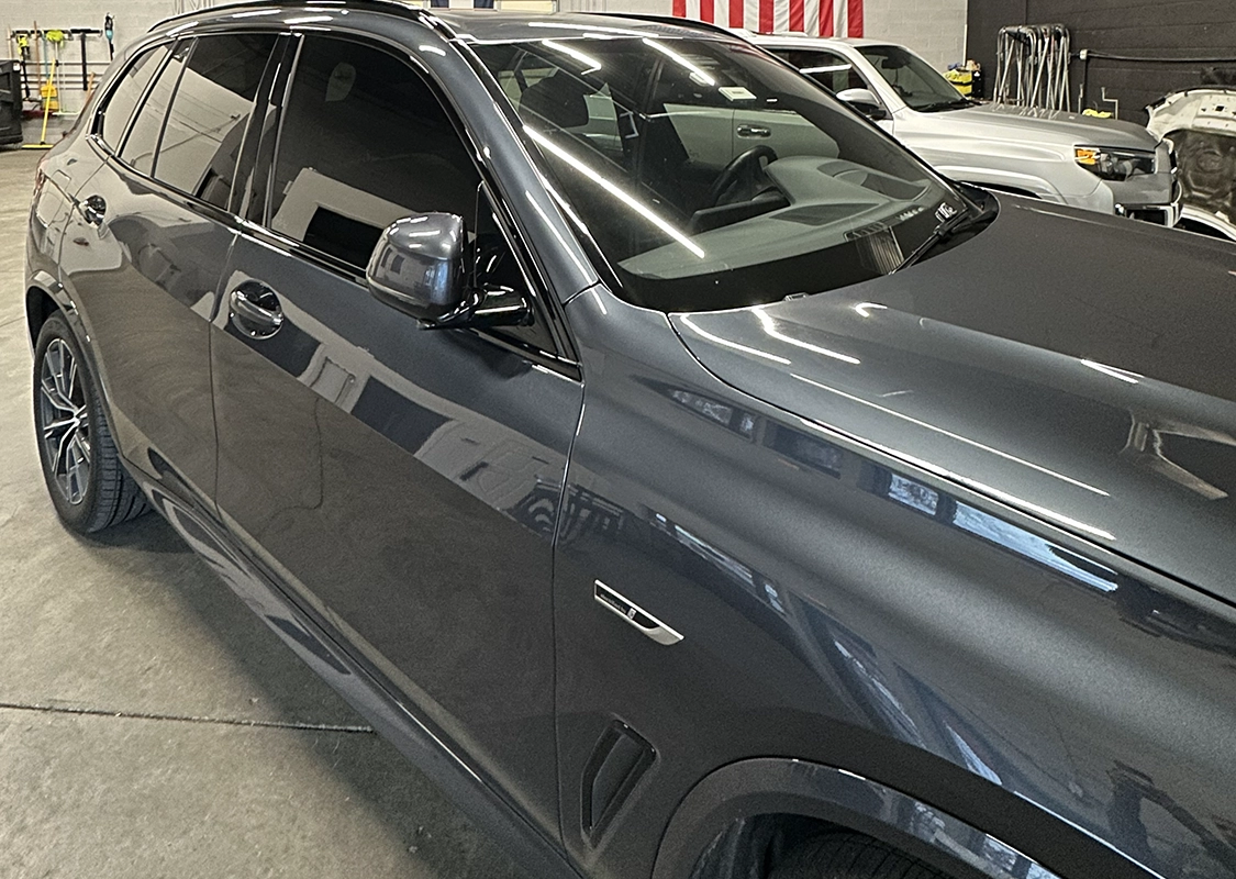 Vehicle receiving paintless dent repair for hail damage
