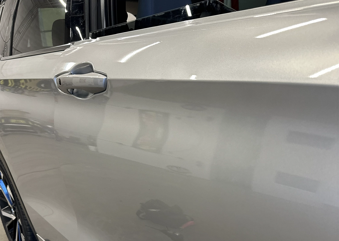 Professional paintless dent repair service for vehicle damage at Precision PDR